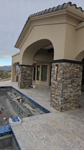 Outdoor wall lighting fixtures installed on stone pillars by JGM Electric INC. in Glendale, AZ