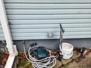 A newly installed outdoor weatherproof electrical outlet on a house siding, a service provided by Rylix Electric in Cincinnati, OH.