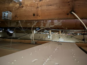 Overhead electrical connections and wiring in a building, expertly handled by Watts Happening Electric in Lakewood, CO.