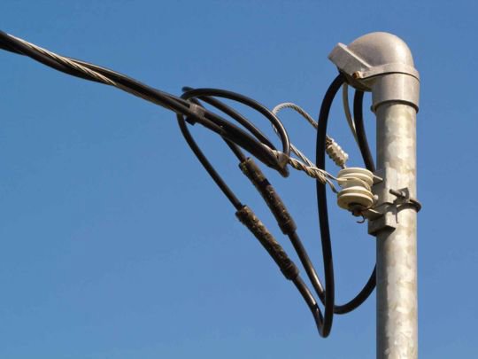 Overhead electrical service lines connection by Madison Electrician Now in Madison, AL.