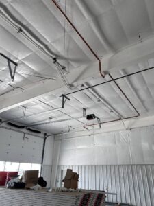 Overhead HVAC piping and ductwork installed in a commercial building by KCC Mechanical, LLC in Sandy, UT.