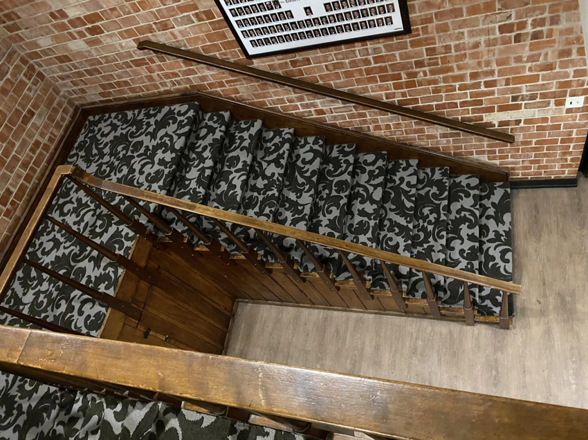 An overhead view of a patterned carpet installation on a staircase by Top Quality Floors LLC in Oklahoma City, OK.