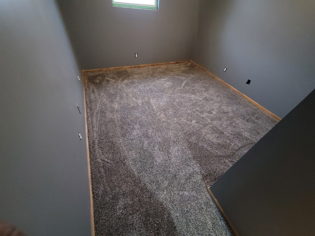 An overhead view of a room with new grey carpet installation by Washington Family Flooring LLC in Bellevue, NE.