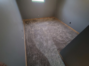 An overhead view of a room with new grey carpet installation by Washington Family Flooring LLC in Bellevue, NE.