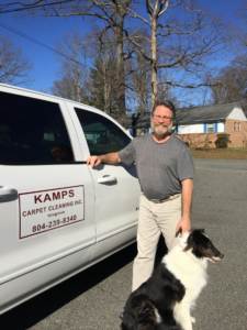 The owner of Kamps Carpet Cleaning Inc. with his company truck and dog in Richmond, VA, ready for service.