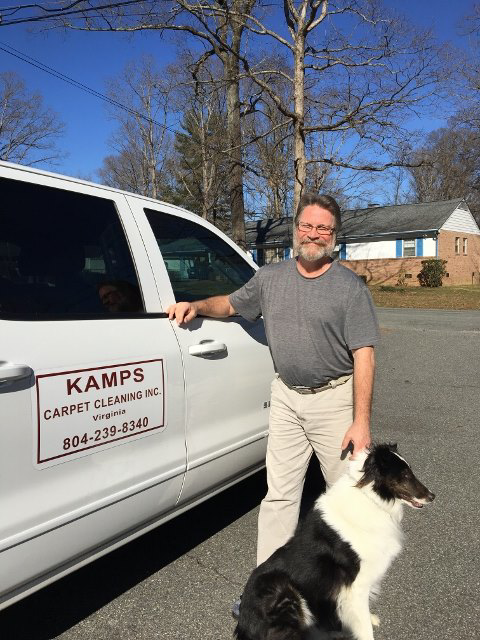 The owner of Kamps Carpet Cleaning Inc. with his company truck and dog in Richmond, VA, ready for service.