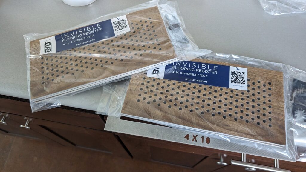 Packaged 'Invisible Flooring Register' products ready for installation by BYLT Living in Sandy, UT