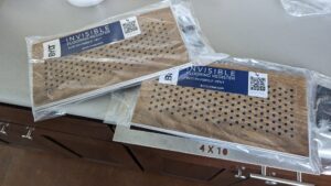 Packaged 'Invisible Flooring Register' products ready for installation by BYLT Living in Sandy, UT