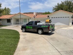 A Pallas Pest Control service truck parked in front of a residential home in Saint George, UT.