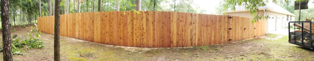 A panoramic view of a newly installed wood privacy fence by Fences & Landscape Inc in Little Rock, AR.