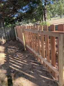 A partially built wooden picket fence showing new construction by Fianna Fencing Company in Fort Smith, AR.
