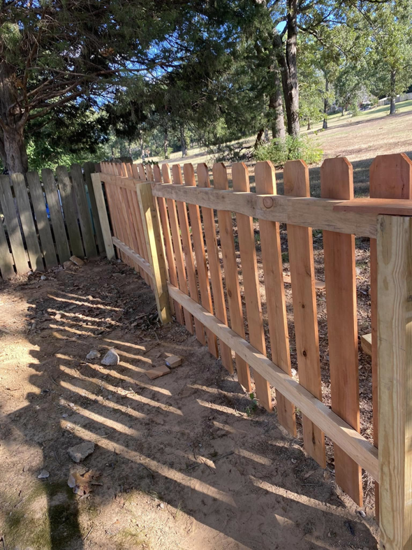 A partially built wooden picket fence showing new construction by Fianna Fencing Company in Fort Smith, AR.