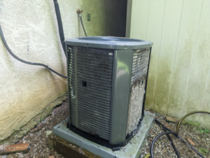 A partially cleaned outdoor air conditioning unit during maintenance by Polaris Heating and Cooling in Columbus, OH.