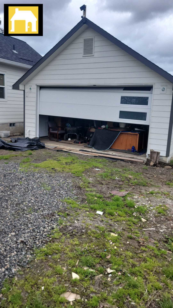 A modern garage door partially open, showing the interior of a garage, serviced by TH Locksmith And Garage Door Repair, Vancouver, WA