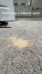 A bleach spot on a carpet, indicating a carpet repair job for patching by Hughes Dry Professional Carpet Care in Marietta, GA.