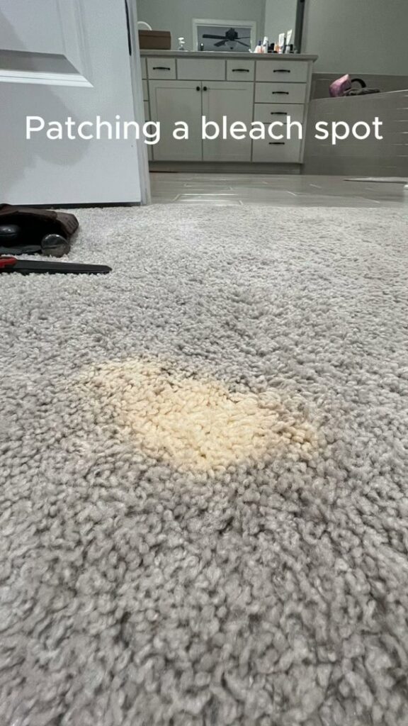 A bleach spot on a carpet, indicating a carpet repair job for patching by Hughes Dry Professional Carpet Care in Marietta, GA.