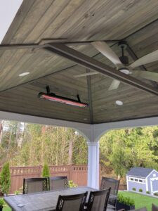 An outdoor patio ceiling fan and heater installed by Good Contact Electric, LLC, showcasing electrical work in Tacoma, WA.