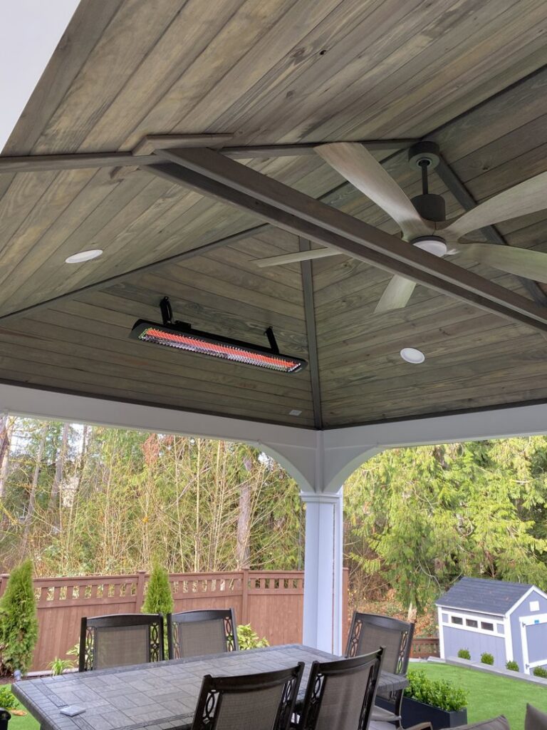 An outdoor patio ceiling fan and heater installed by Good Contact Electric, LLC, showcasing electrical work in Tacoma, WA.