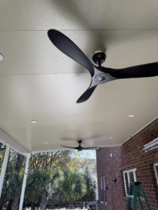 Modern ceiling fans and recessed lighting installed on an outdoor patio ceiling by Watts Up Electric LLC in Summerville, SC.