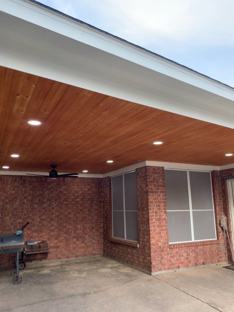 A finished outdoor patio featuring recessed lighting and a ceiling fan installed by LOJ Electric, LLC in Houston, TX.