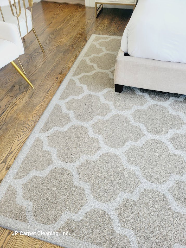 A clean, patterned area rug in a bedroom by JP Carpet Cleaning Expert Floor Care in Granada Hills, CA