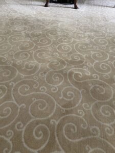 Close-up of a professionally installed patterned beige carpet by Carpet Warehouse Lorain LLC in Lorain, OH.