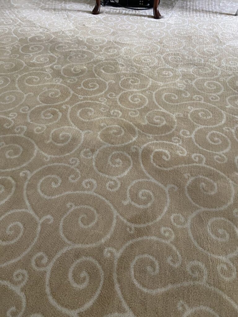 Close-up of a professionally installed patterned beige carpet by Carpet Warehouse Lorain LLC in Lorain, OH.