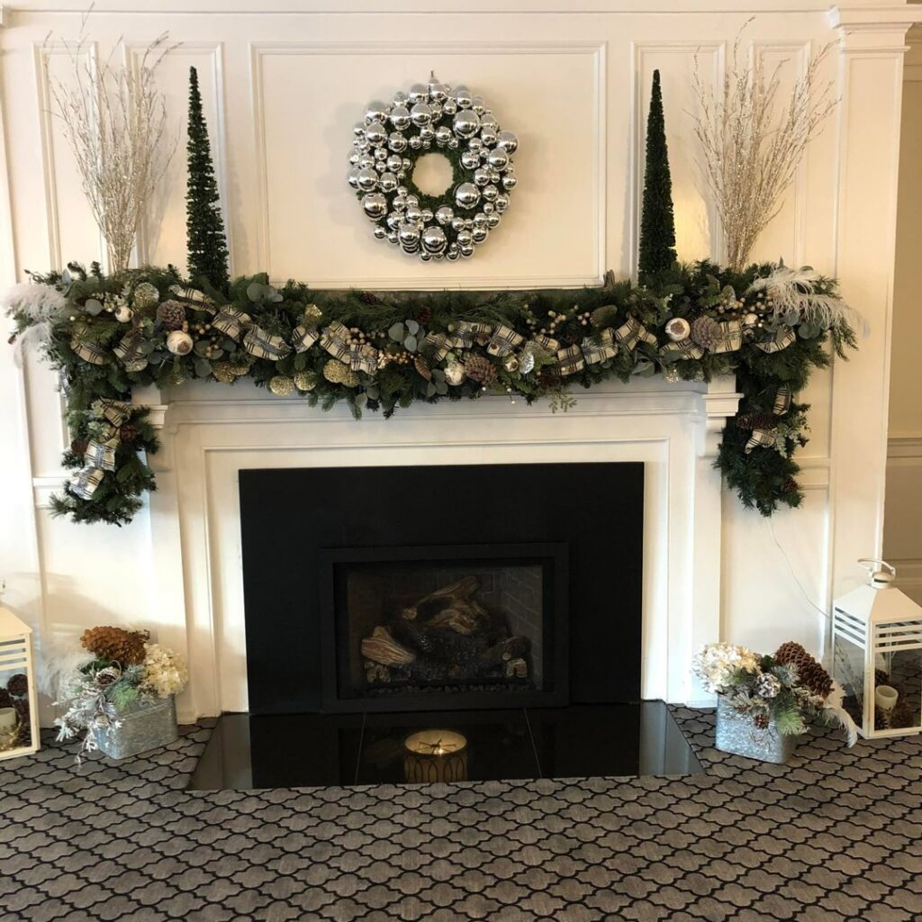 A close-up view of a patterned carpet installed around a fireplace area by National Carpet and Flooring in Tyngsboro, MA.