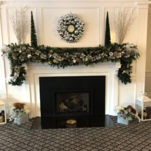 A close-up view of a patterned carpet installed around a fireplace area by National Carpet and Flooring in Tyngsboro, MA.