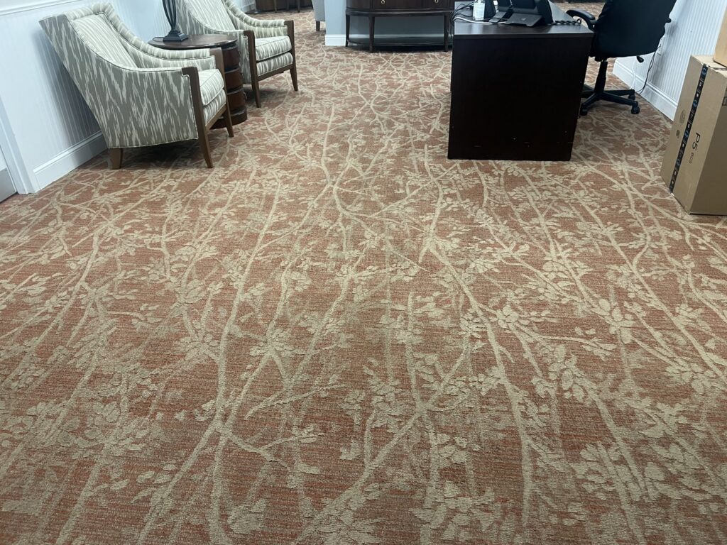 A clean, patterned carpet in an office or waiting area, demonstrating the types of commercial spaces served by JDog Carpet Cleaning & Floor Care Alpharetta in Roswell, GA.