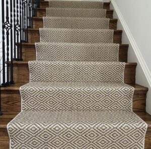 A newly installed patterned carpet runner on a wooden staircase by Floors Next Day in Austin, TX.