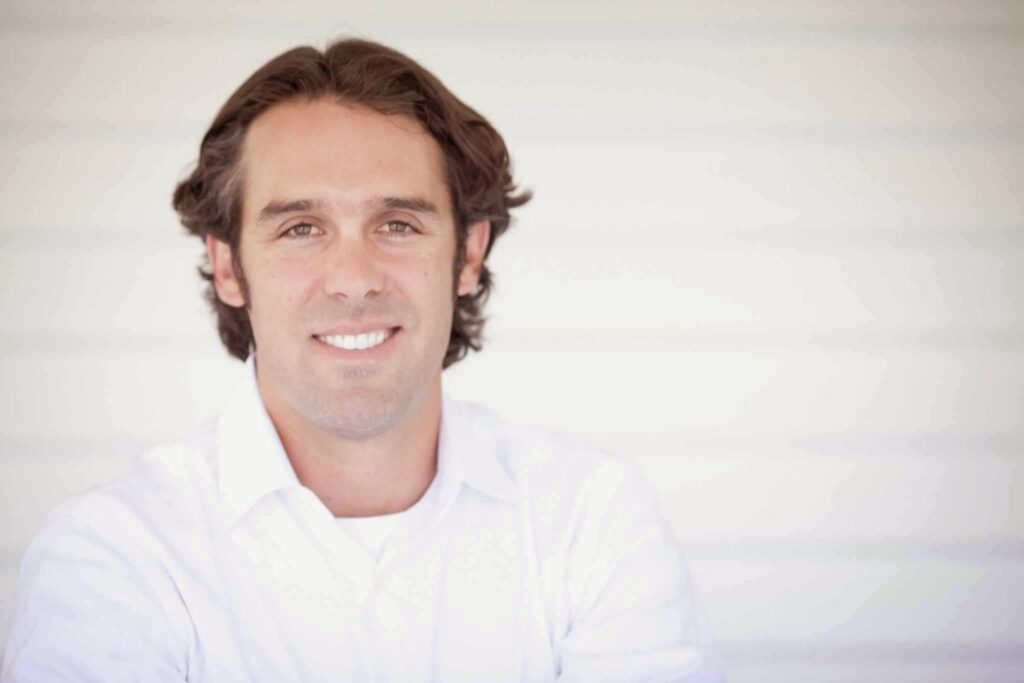 A beautifully installed patterned carpet runner on a wooden staircase by O'Hanlon Home Services in Austin, TX.