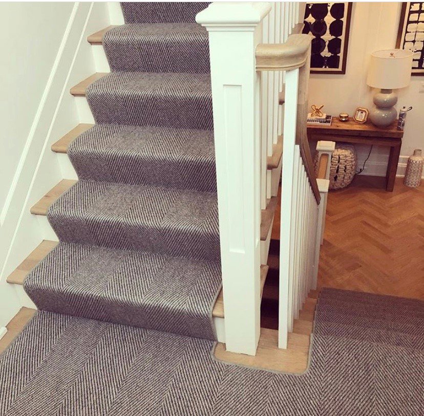 Elegant patterned carpet runner installed on a staircase by Creative Carpet Solutions LLC, a professional carpet contractor in Houston, TX.