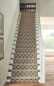 A staircase featuring a stylish patterned carpet runner installed by Floor Coverings International Metro OKC in Moore, OK.