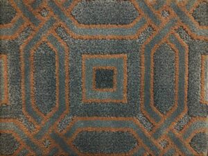 A close-up view of a blue and brown patterned carpet sample from Adda Carpet and Flooring in New Orleans, LA.