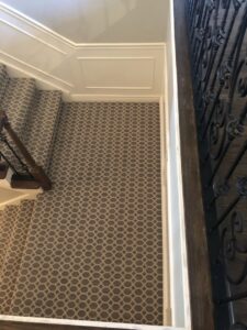 A beautifully installed patterned carpet stair runner by Battleson's Flooring in Idaho Falls, ID.