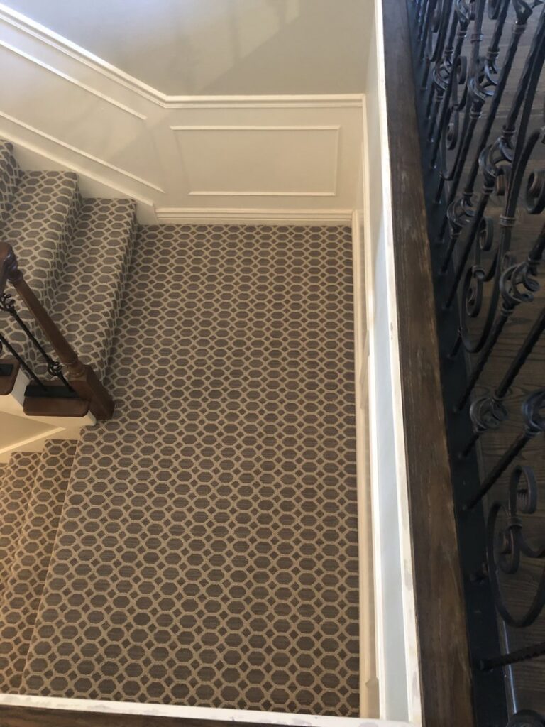 A beautifully installed patterned carpet stair runner by Battleson's Flooring in Idaho Falls, ID.