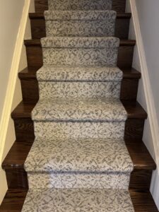 Newly installed patterned carpet on a staircase by Burkholder's Flooring America in Hagerstown, MD.
