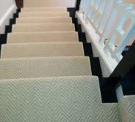 A stylish patterned carpet stair runner installed by Flooring Cleveland - Ohio City, serving homes in Cleveland, OH.