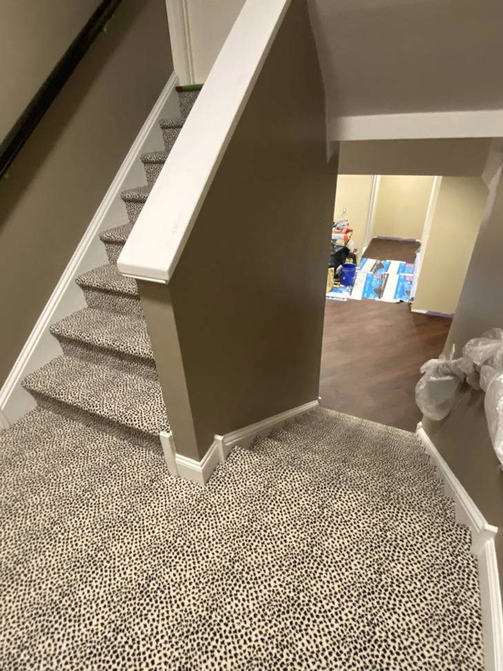 A newly installed patterned carpet on a staircase and landing by Dodson Floorcoverings in Birdsboro, PA