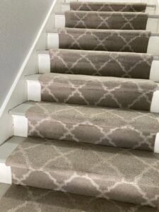 Beautifully installed patterned carpet on a staircase, showcasing quality work by Master Green Cleaning in Overland Park, KS.