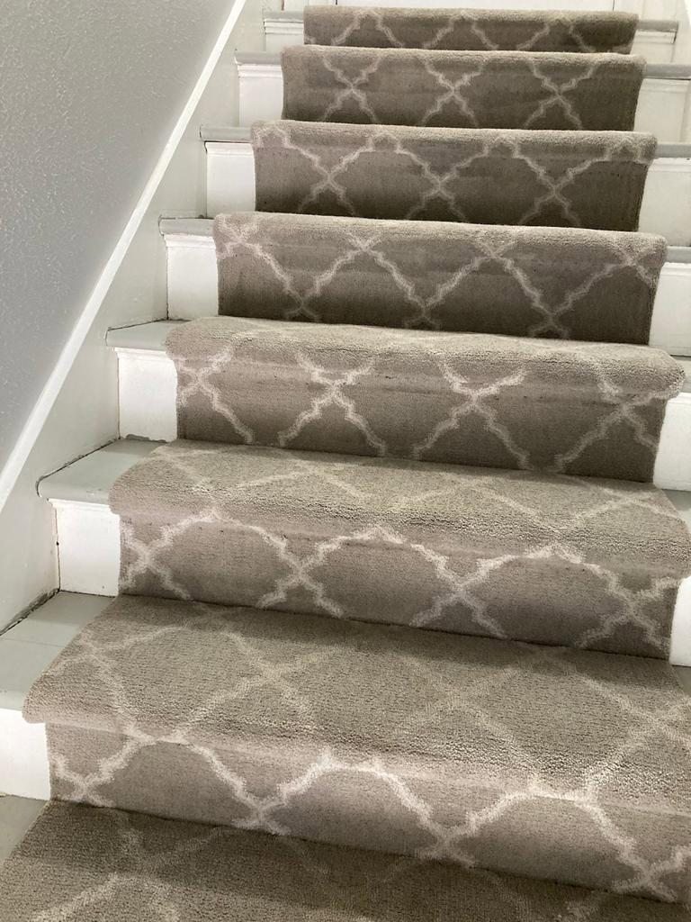 Beautifully installed patterned carpet on a staircase, showcasing quality work by Master Green Cleaning in Overland Park, KS.