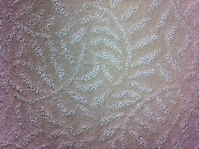 A close-up view of a clean, patterned carpet texture by Kelley's Cleaning & Restoration in Everett, WA.