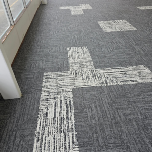 Stylish patterned grey and white carpet tiles installed by LaValle Flooring Inc - Valley City in Valley City, ND.