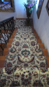 A beautifully installed patterned carpet runner on a residential staircase by Ko-Z-Craft in Los Angeles, CA.