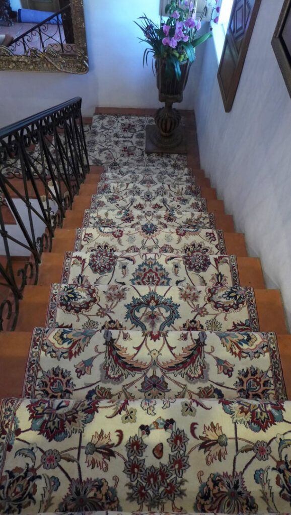 A beautifully installed patterned carpet runner on a residential staircase by Ko-Z-Craft in Los Angeles, CA.