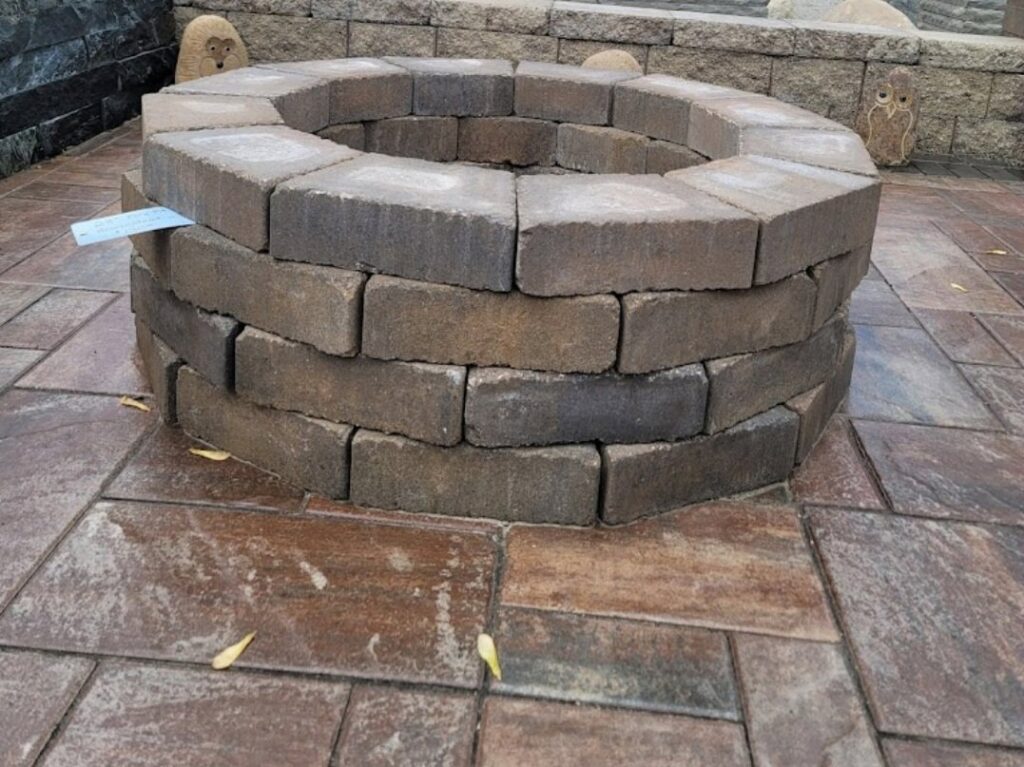 A newly constructed paver fire pit on a patio by ALL Lawn Care Service in Saint Louis, MO
