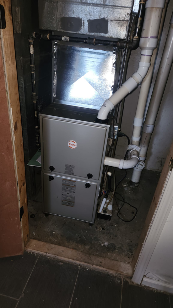 A new Payne furnace and ductwork installed in a utility closet by McBride HVAC Solutions LLC in Cincinnati, OH