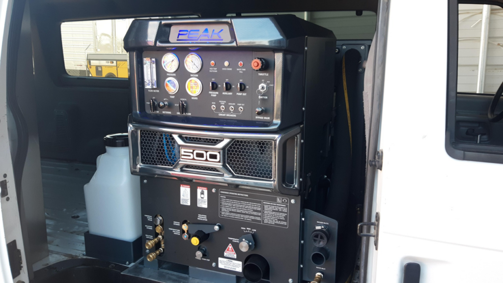 A PEAK 500 truckmount carpet cleaning machine installed in a service van for Delmac Products Truckmount Service in Bakersfield, CA.