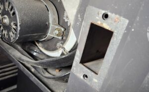 Close-up of pellet stove internal components during maintenance by Top Dog Hearth Repair & Maintenance, LLC in Worcester, MA